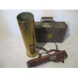 A Sam Browne belt, a brass shell dated 1945 plus an ammo box.