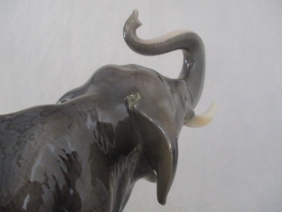 A ceramic elephant. Height 41cm. Has had a repair to one tusk. AF - Image 9 of 15