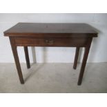 A Georgian mahogany tea table with fold over top