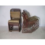 A set of twelve tubular and slatted stacking chairs - few slats missing
