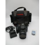 A Canon EOS 450D camera with Canon Zoom lens EF-S in carry bag