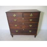 An antique oak chest of five drawers