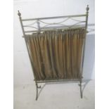 A turn of the century brass firescreen