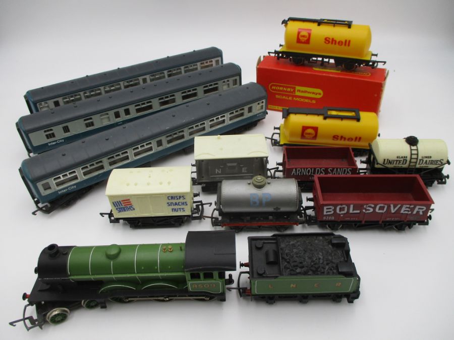 A Hornby OO gauge locomotive and tender (8509), along with three Inner City coaches and a