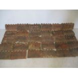 Thirty Victorian terracotta edging tiles.