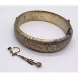A hallmarked silver hinged bracelet along with a single 9ct gold earring (weight 0.6g)