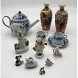 A small collection of Oriental china along with a selection of small foreign figurines including