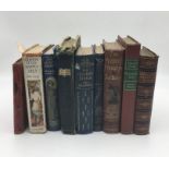 A collection of vintage and antique books including "Longfellow's Poetical Works" published by