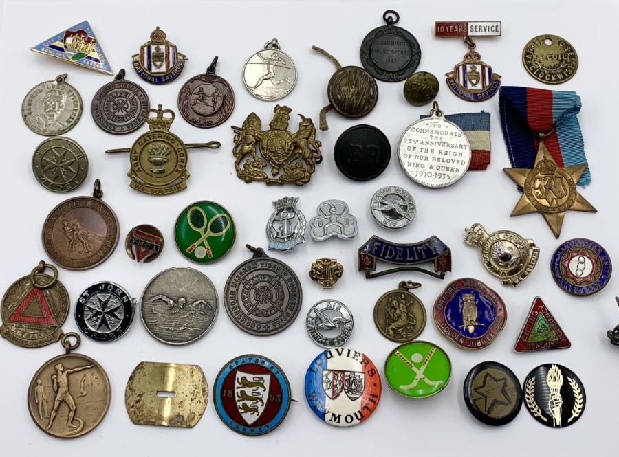 A small collection of various badges, medallions etc