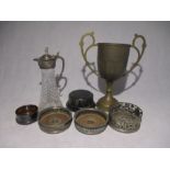 An antique brass trophy engraved with Maldive Ashes, along with a small collection of silver