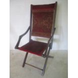 A turn of the century folding campaign chair