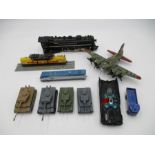A small collection of toys including a Corgi Batmobile, four tanks, Amtrak locomotive, steam