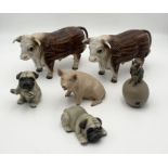 A collection of various animal figurines including a pair of Harvey Knox pugs, a pair of German made