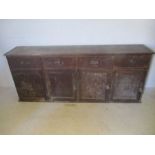 An antique pine dresser base