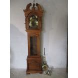 A reproduction Grandmother clock with moon face.