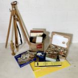 A collection of art supplies, easel etc.