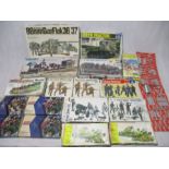 A collection of various boxed military plastic model construction kits including a Lindberg German