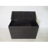 A black painted storage trunk