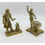 Two brass figures showing tradesman at work
