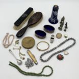 A collection of costume jewellery, silver mounted brushes etc.