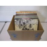 A collection of various 12" vinyl records including The Beatles, Fleetwood Mac, The Rolling