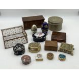A collection of wooden and ceramic small boxes