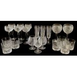A collection of cut glass ware including two Waterford Crystal long stemmed glasses.