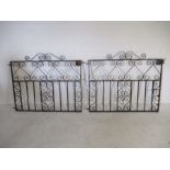 A pair of wrought iron garden gates