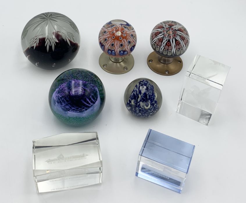 A small collection of paperweights to include Caithness and two adapted into doorknobs