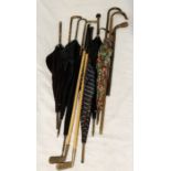 A collection of vintage ladies umbrella's, walking sticks and golf clubs
