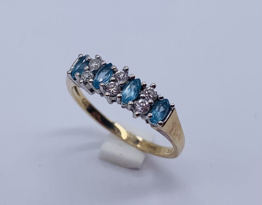 A 9 ct gold dress ring set with topaz and CZ