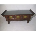 A Chinese hardwood low altar table with scroll end top, three drawers and brass handles - W 135cm