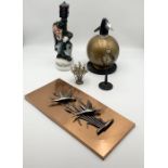 A collection of various items including West German copper wall plaque, vintage soda siphon, novelty