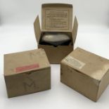 Three WW2 respirators in original boxes marked B.C.C. Ltd. One labelled for Torbay.