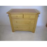 A modern beech chest of four drawers