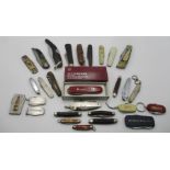 A collection of various penknives including Victorinox, Girl Guides, advertising etc.