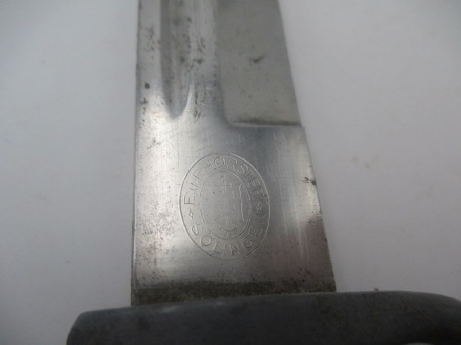 A German WWII bayonet, the steel blade stamped E u F Horster, Solingen, with eagle head handle, - Image 3 of 7