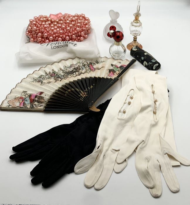 A collection of various items including three scent bottles, two vintage pairs of long gloves, a bag