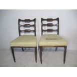 Two early Victorian curved back dining chairs, one has a plaque "Bartholomew & Fletcher