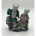 A 18th/19th century Chinese porcelain figure group with damage as shown