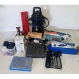 A collection of various motor related tools including jacks, pressure washer, tyre inflator, socket