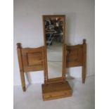 A pine Cheval mirror with single drawer under, along with pine bed head board