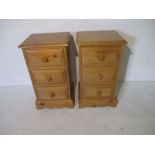 A pair of pine bedside cabinets