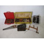 A collection of various tools including Spear & Jackson "Spearior" saw, hammers, chisels, drill