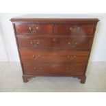 A Georgian oak chest of five drawers