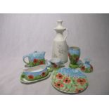 A collection of seven pieces of Honiton Pottery "Poppy" design including a vase, plate, double