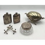 A cut glass dressing table pot with hallmarked silver top along with two silver plated hip flasks,