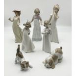 A collection of Lladro and Nao figurines
