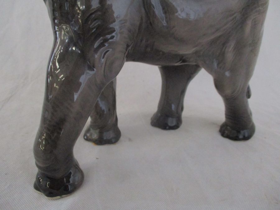 A ceramic elephant. Height 41cm. Has had a repair to one tusk. AF - Image 3 of 15