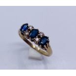 A diamond and sapphire ring set in 9ct gold